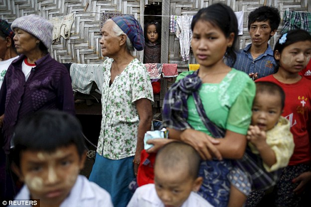 Refugees line the streets waiting for the Hollywood star to arrive in the state of Kachin